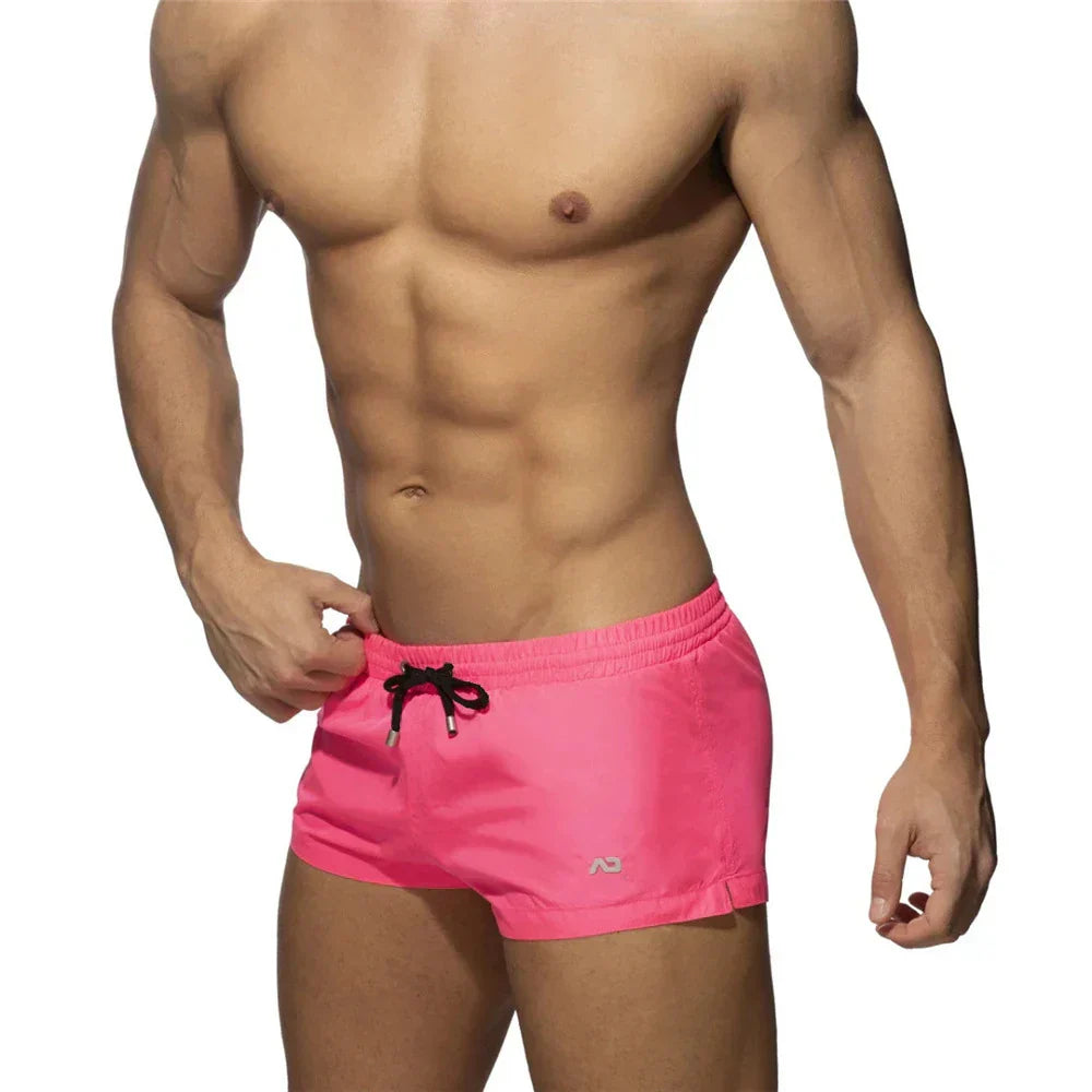 New Mens Swimming Trunks Classic Solid Color Three Point Quick Drying Swimming Trunks Low Waist Sexy Beach Surfing Sports Shorts