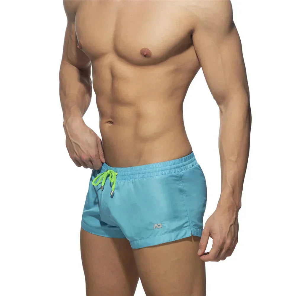 New Mens Swimming Trunks Classic Solid Color Three Point Quick Drying Swimming Trunks Low Waist Sexy Beach Surfing Sports Shorts
