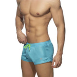 New Mens Swimming Trunks Classic Solid Color Three Point Quick Drying Swimming Trunks Low Waist Sexy Beach Surfing Sports Shorts